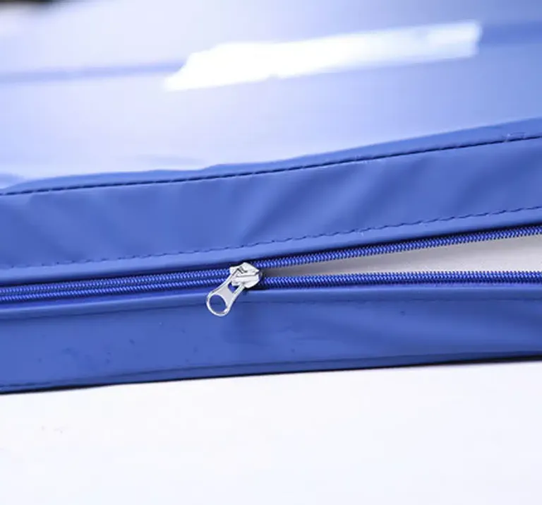 Close-up of the zip on a blue PU hospital mattress cover